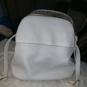 White faux leather purse back pack